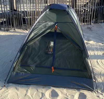 a green tent on the beach in the sand at Amora Beach Camping in Baru