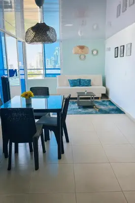 a living room with a table and chairs and a couch at Azul Caribe Home in Cartagena de Indias
