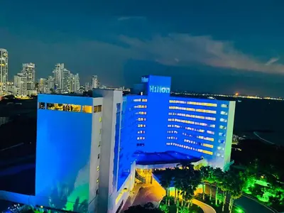 a large building with blue lights on it at night at Azul Caribe Home in Cartagena de Indias