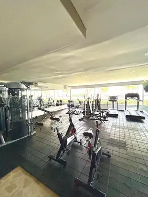 a gym with a bunch of cardio equipment in it at Apartamento con piscina gigante y acceso directo al mar in Cartagena de Indias