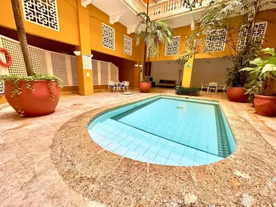 a swimming pool in the middle of a building at By Calamari Homes - Ayos 206 - Walled City in Cartagena de Indias