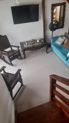 a living room with a couch and a table at Hostal Casa Adela