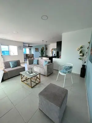 a living room with two couches and a coffee table at Acogedor apartamento con súper ubicación in Barranquilla