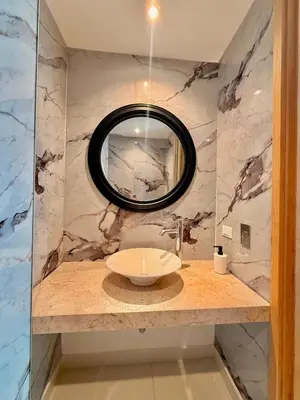 a bathroom with a sink and a mirror at Karibmed Cartagena in Cartagena de Indias