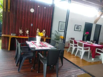 a dining room with a table and chairs at Habitacion doble en Villakite ,Salinas del Rey in Juan de Acosta