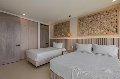two beds in a hotel room with two beds sidx sidx sidx at 