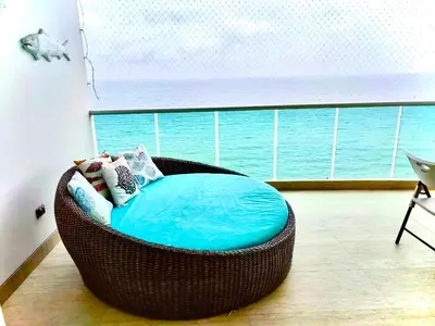 a round bed in a room with a view of the ocean at 3BR AC Amazing View and Pool, Best sunset ever in Coveñas