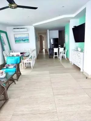 a living room with chairs and a dining room at 3BR AC Amazing View and Pool, Best sunset ever in Coveñas