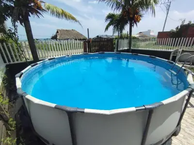 a large swimming pool with blue water at La Cabana de Isaac Boquilla in Cartagena de Indias