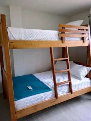 a couple of bunk beds in a room at Palmar in Playa Dormida