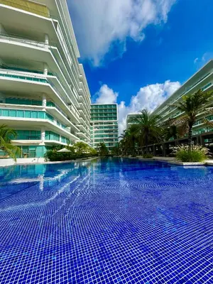 a swimming pool in front of a building at Apartamento Cartagena in Cartagena de Indias