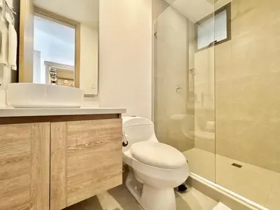a bathroom with a toilet and a sink and a shower at Spectacular view of the Caribbean Sea in Cartagena de Indias