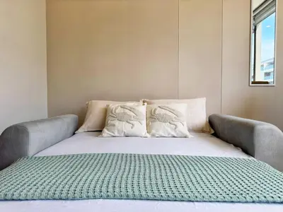 a bed with two pillows on top of it at Spectacular view of the Caribbean Sea in Cartagena de Indias