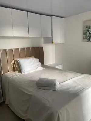 a white bed with two towels on top of it at Entire apartment with amazing views Tower 811 in Cartagena de Indias