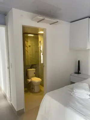a white bedroom with a toilet and a bathroom at Entire apartment with amazing views Tower 811 in Cartagena de Indias