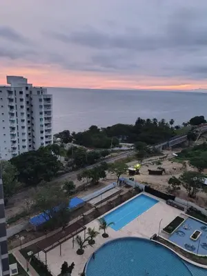 an aerial view of a swimming pool and the ocean at Santa Marina Santa Marta - By INMOBILIARIA VS in Santa Marta