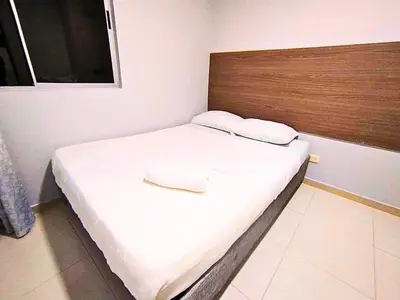 a bed with two pillows on it in a room at Exclusivo Torices con Vista al Mar in Arizona