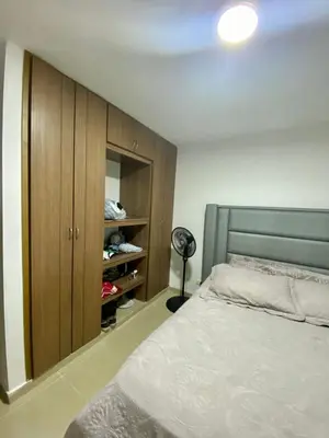 a bedroom with a bed and a closet at Apartamento en villa campestre Barranquilla in Barranquilla