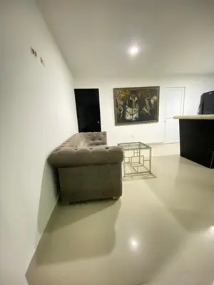 a living room with a couch and a table at Apartamento BBB para 4 pax en La Boquilla in Cartagena de Indias