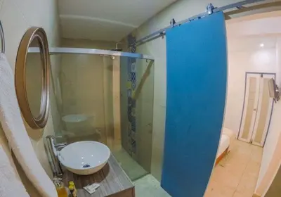 a bathroom with a glass shower and a sink at Casa Heredia Boutique in Cartagena de Indias