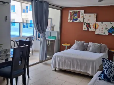 a bedroom with a bed and a large window at La perla in Cartagena de Indias