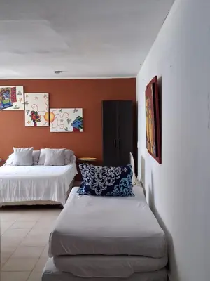a hotel room with two beds in a room at La perla in Cartagena de Indias