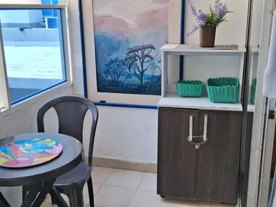 a dining room with a table and a chair and a table and a tableablish at La perla in Cartagena de Indias