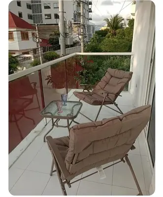 two chairs and a table on a balcony at Apartamento en Cielo Mar in Cartagena de Indias