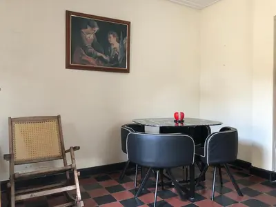 a room with a table and chairs and a painting at Entire apartment bathroom AC Smart tv wifi kitchen in Barranquilla
