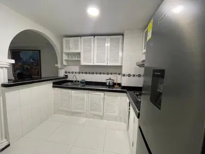 a white kitchen with a sink and a refrigerator at expetacular apartamento de 4 alcobas in Cartagena de Indias