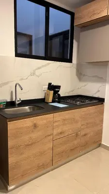 a kitchen counter with a sink and a window at Sofia del Mar in Puerto Colombia