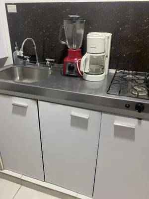 a kitchen counter with a sink and a blender at Apartaestudio Económico en Cartagena, al lado de la Playa in Cartagena de Indias