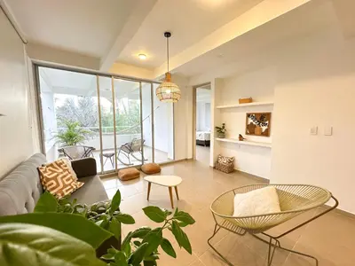 a living room with a couch and a table at Villa in Sabanilla near the Sea in Maizal