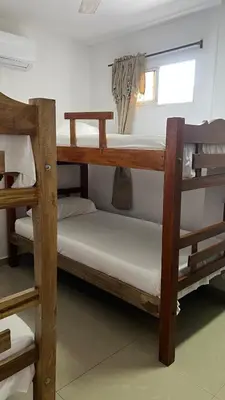 two bunk beds in a room with a window at GUILLO Comfort Loft 2 in Cartagena de Indias