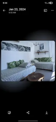 a room with two beds and a coffee table at El Laguito Apto Edf Nuevo Conquistador in Cartagena de Indias
