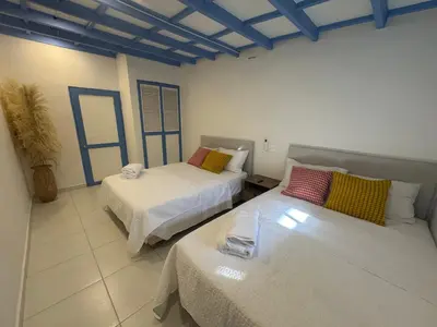 a room with two beds in a room at Cozy duplex at Cartagena City Center in Cartagena de Indias