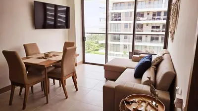 a living room with a couch and a table at APARTAMENTO MORROS EOS y ECO VISTA AL MAR in Cartagena de Indias