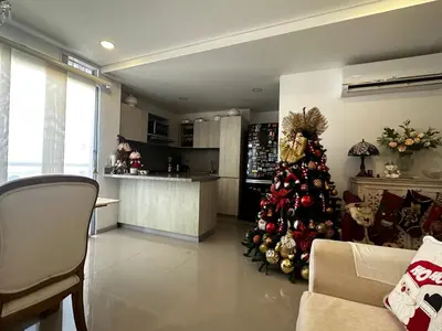 a christmas tree in the middle of a living room at Lujoso apartamento frente al Castillo de San Felipe in Cartagena de Indias