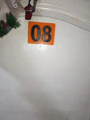 an orange and black number in a white tub at Hostal Mastcoy in Cartagena de Indias