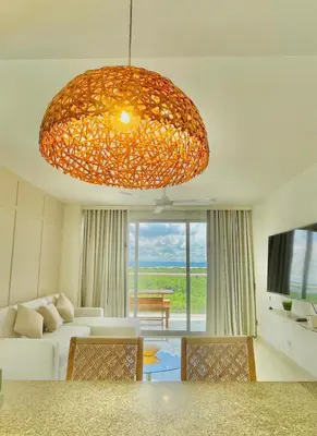 a living room with a large chandelier at Luxury apartment sea view with pool- central 12 min from the city center in Cartagena de Indias