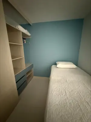 a small bedroom with a bed and a closet at Piso Don Omar in Cartagena de Indias