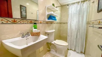 a bathroom with a white sink and a toilet at Excepcional apartamento Cartagena in Cartagena de Indias