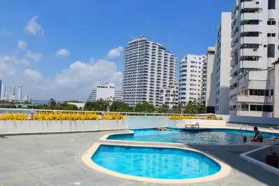 a swimming pool in a city with tall buildings at Excepcional apartamento Cartagena in Cartagena de Indias