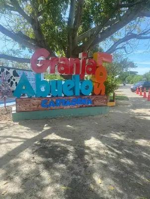 a sign for a park with a tree at apartment near the beach con piscina, gym y coworking in Manzanillo del Mar