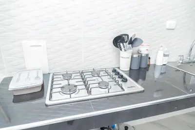 a stove top on a counter in a kitchen at Apartamentos King Arthur in Punta Seca