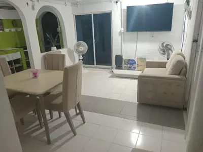 a living room with a table and a couch at shanty guest hostal in Cartagena de Indias