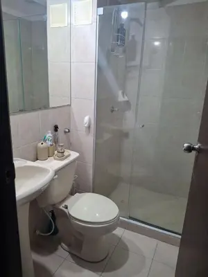 a bathroom with a shower and a toilet and a sink at APARTAMENTO-Miramar in Barranquilla