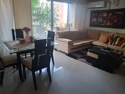a living room with a couch and a table at APARTAMENTO-Miramar in Barranquilla