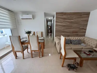 a living room with a couch and chairs and a table at Conjunto Residencial Caribe Campestre in Coveñas