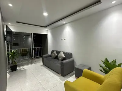 a living room with a couch and a chair at Entrelagos beautiful apartment in Cartagena de Indias